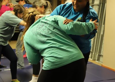 Students practice hands-on self defense